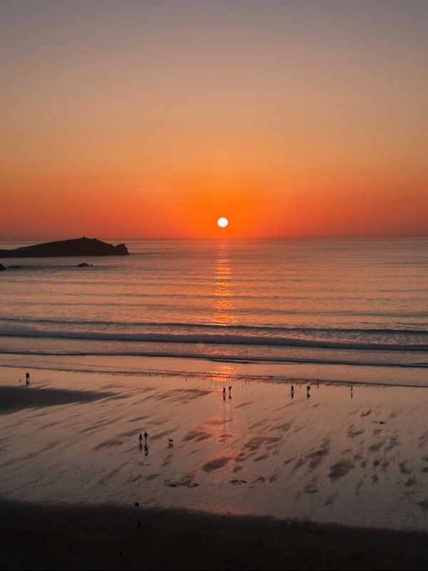 Sun setting over the sea at Newquay, Cornwall